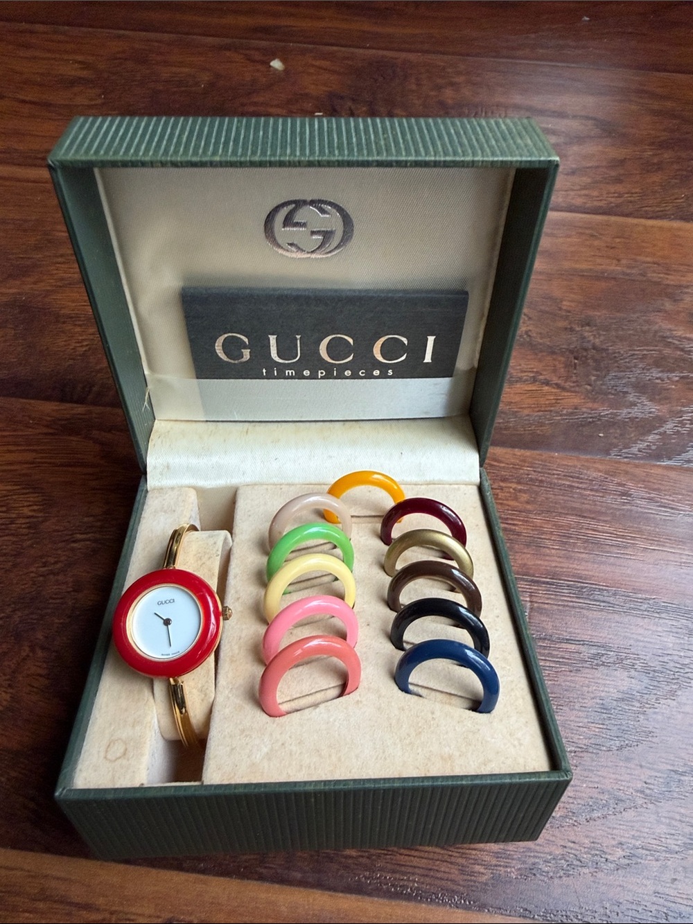 Gucci Women's Gold Bracelet Watch with Interchangeable Red Bezel